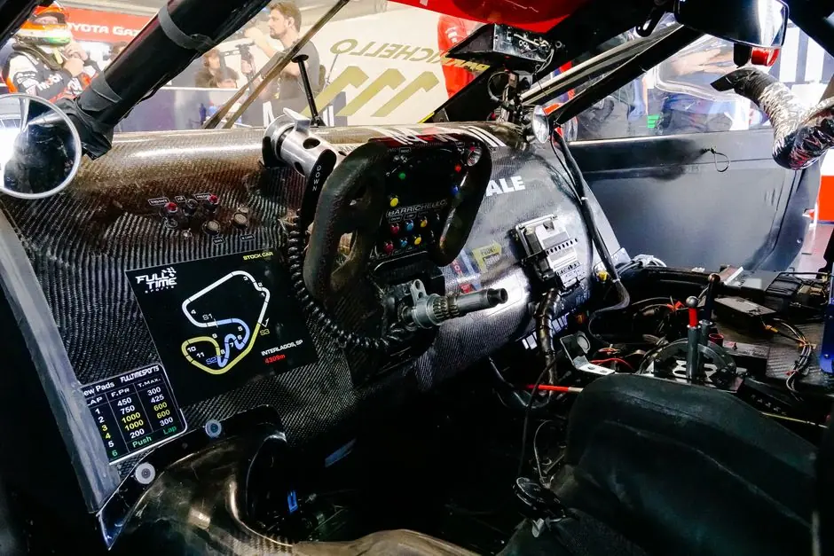 Interior view of the Polaris Slingshot's cockpit showing the steering wheel and seats